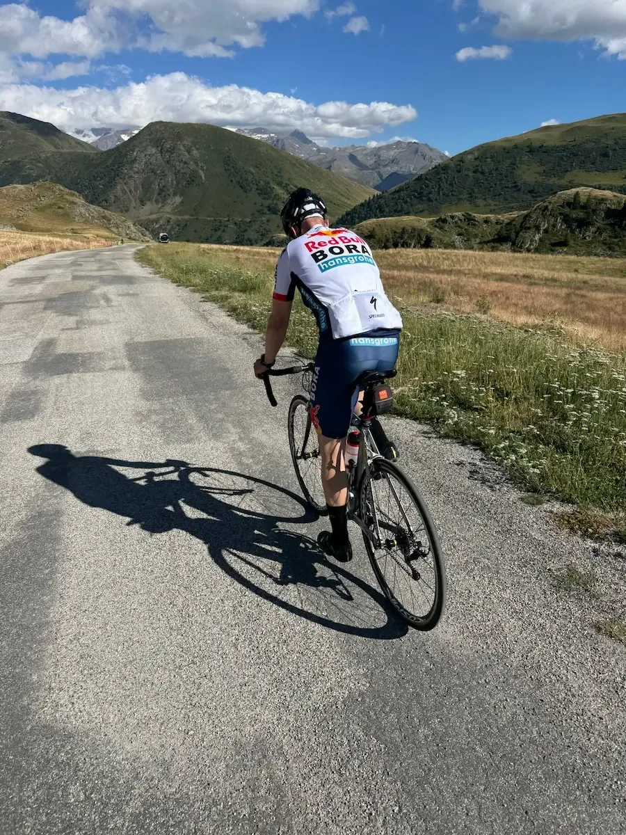 Soft-pedalling across the high pasture above Clavans