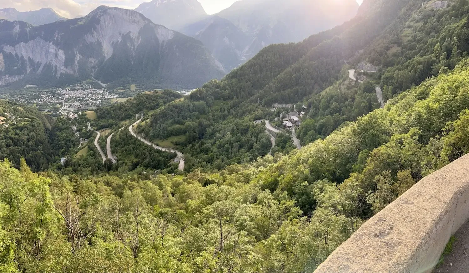 The 21 lacets stacked below, Bourg d'Oisans tiny in the valley