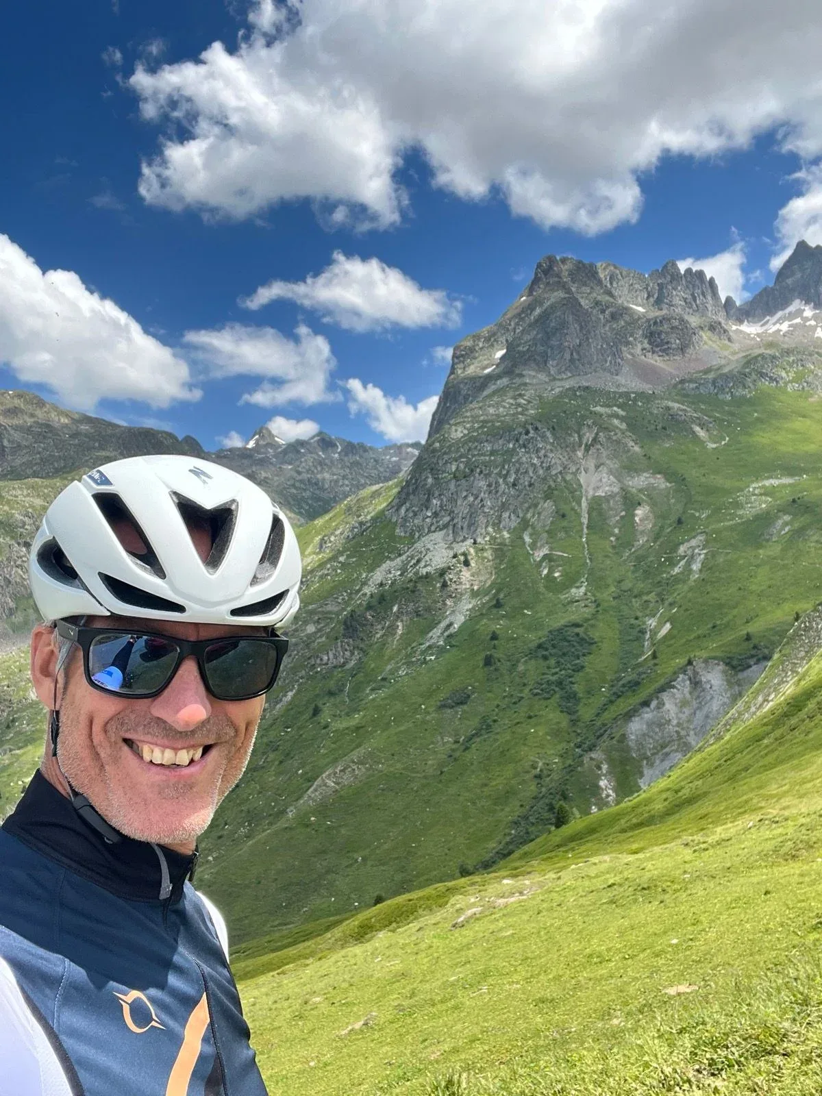 Helmet selfie with the Aiguilles d'Arves on the skyline.