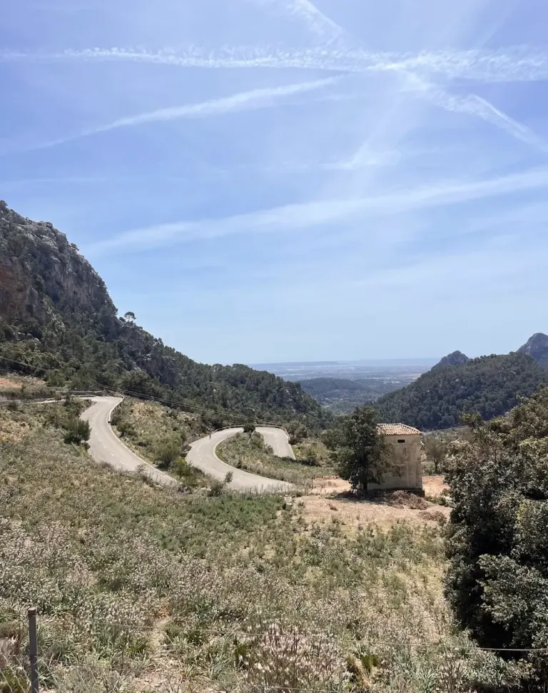 Cycling up Coll de Sóller, Mallorca — serpentine mountain road with dramatic valley views