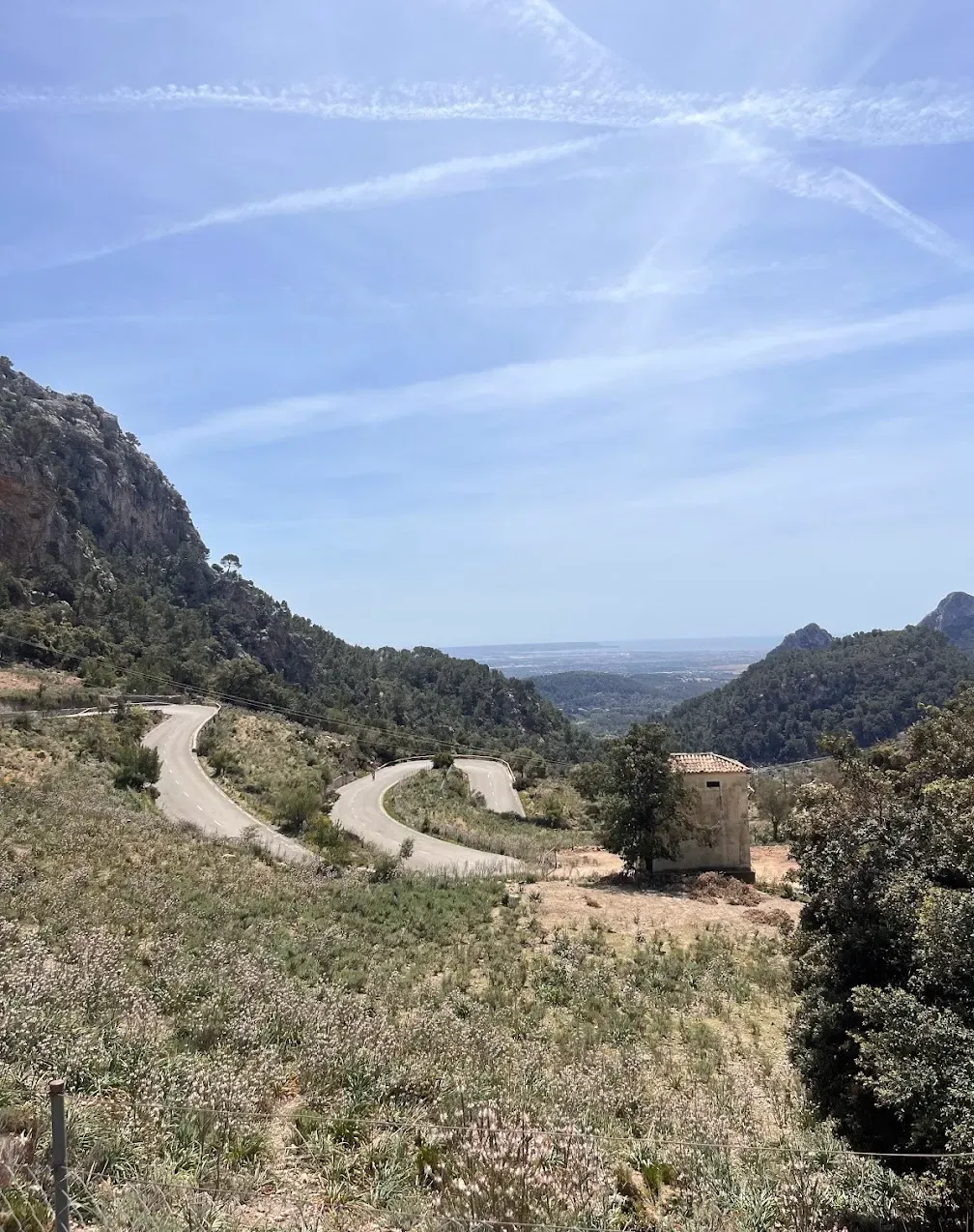 Cycling up Coll de Sóller, Mallorca — serpentine mountain road with dramatic valley views