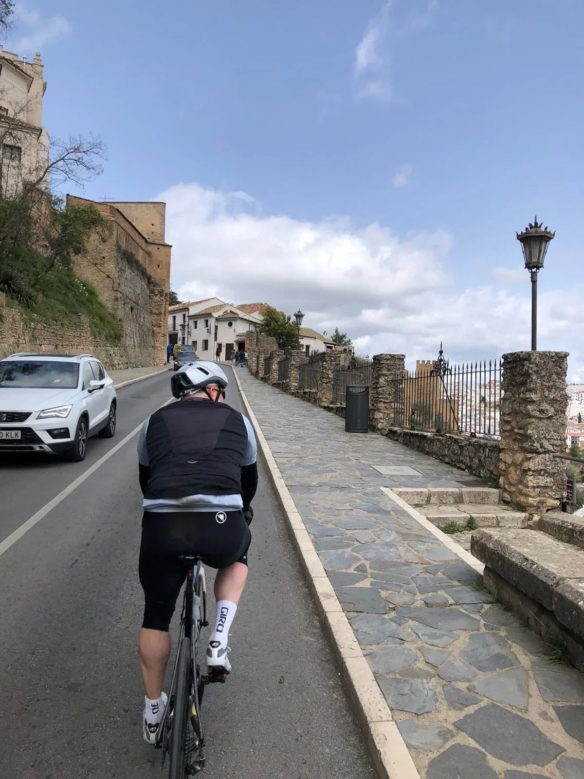 Spinning through Ronda's old town past stone walls and mirador railings