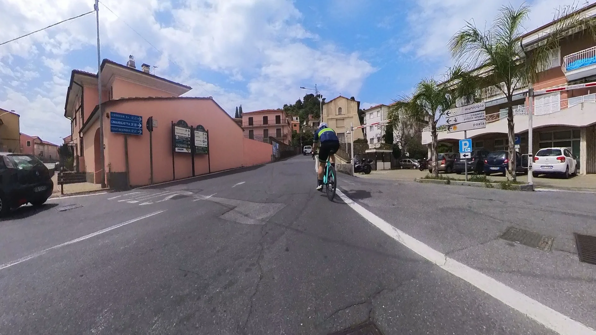Start of the Cipressa climb in San Lorenzo al Mare — sharp right turn off the Via Aurelia