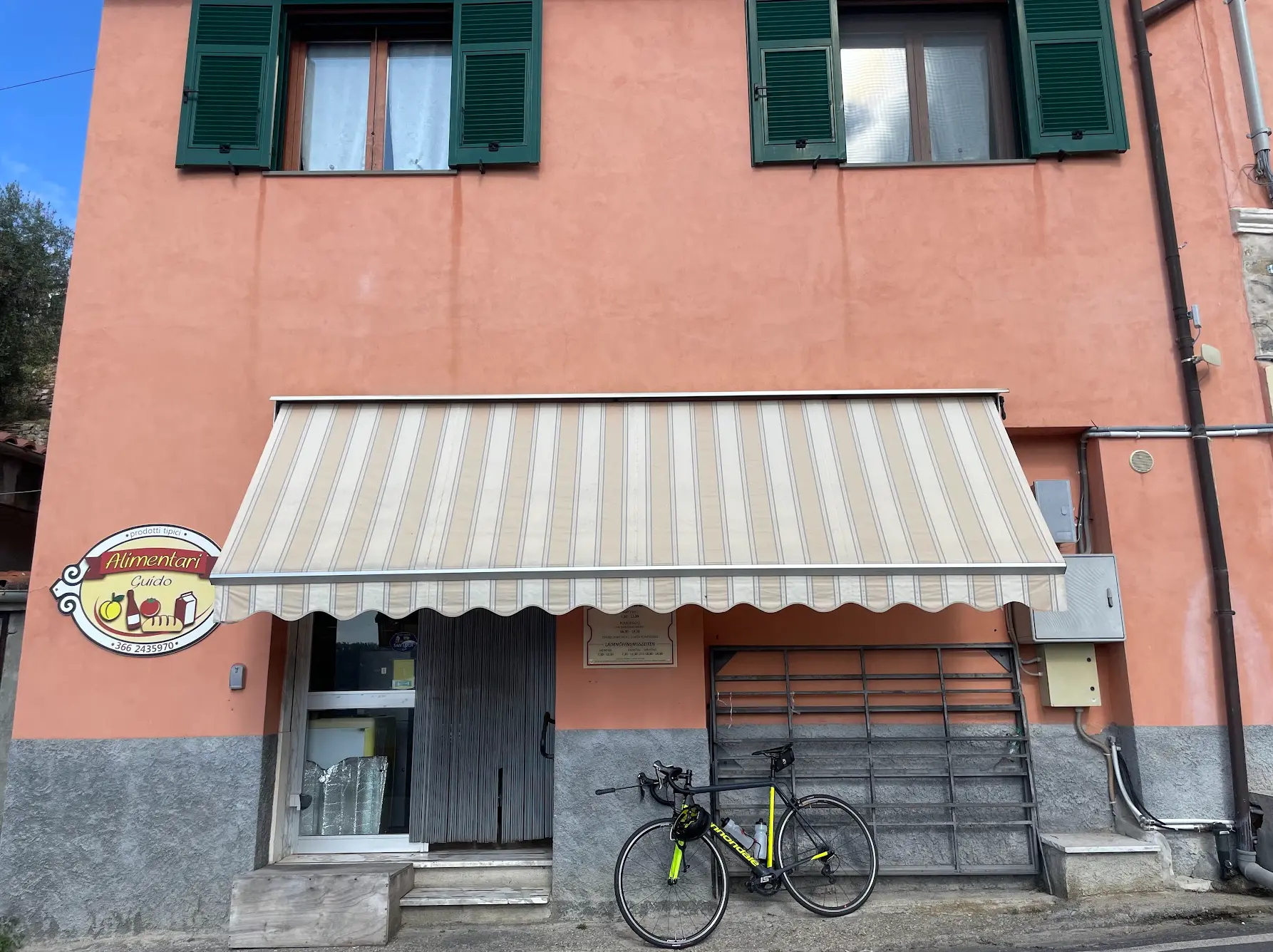 Village shop in Vasia, Liguria — a classic stop on the Colle d'Oggia cycling route from San Remo