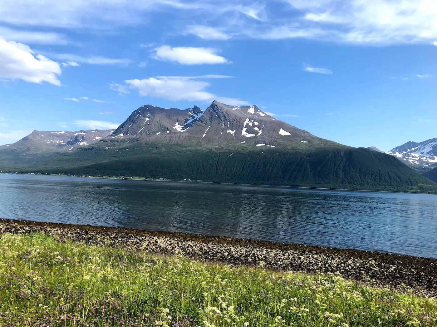 Tromsø cycling route — crossing the Sandnessund Bridge with mountain views in every direction